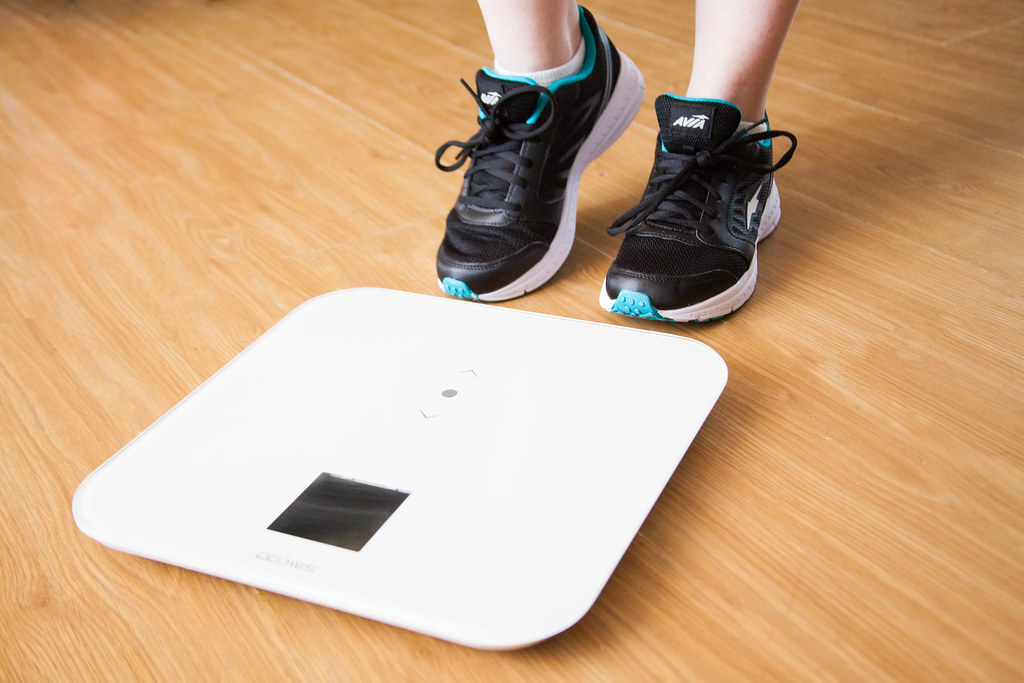 person about to stand on weighing digital scale